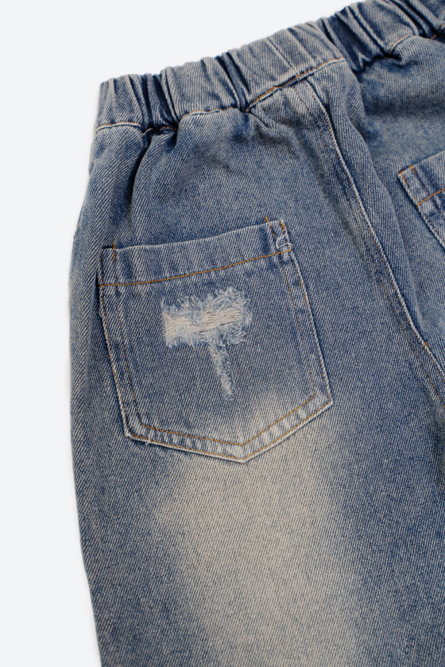 Джинсы с потертостями